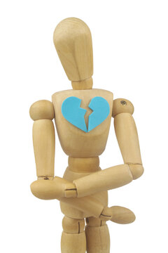 Wooden mannequin or figurine with blue broken heart isolated on white background. Concept of divorce and break up.	