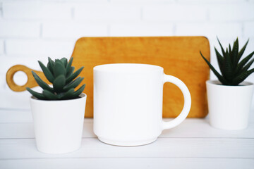 White  mug mockup for presentation sublimation designs, cup with copy space on front in lifestyle setting
