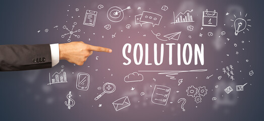 Close-Up of cropped hand pointing at business inscription