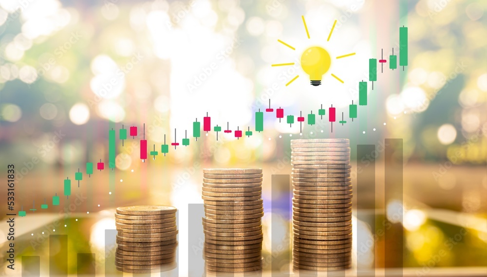 Poster stack of money coin with trading graph candlestick and light bulb idea on bokeh background. stack of