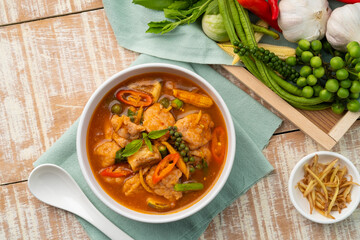 Jungle Curry with clown featherback fishball and vegetable with fingerroot (Gaeng Pa),Thai hot and spicy curry soup without Coconut Milk in white bowl.Top view