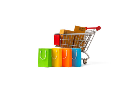 Shopping cart with package boxes and shopping bag isolated on white background