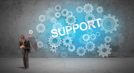 Obraz premium Businessman defending with umbrella concept