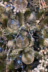 a decorated Christmas tree. Christmas tree glass balls and light garlands