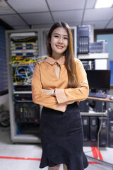 Young smiling woman in blurred server room