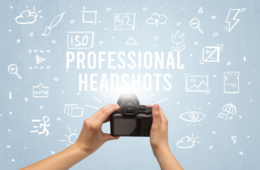 Hand taking picture with digital camera