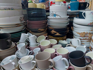 All kind of melamine and ceramic plates, dinner sets and cups bought to a local market to sell.