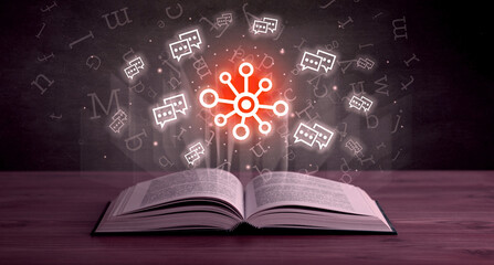 Open book with social networking icons above