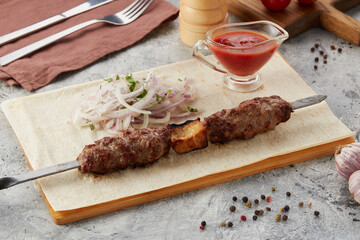 Shashlik or shish kebab on metal skewers