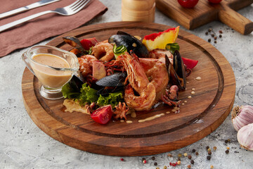 Mixed Seafood - shrimps and mussels with sauce on dish