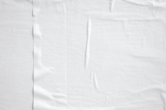 white crumpled and creased paper poster texture background © Piman Khrutmuang