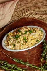 Portion of manioc farofa with eggs, typical Brazilian dish called farofa de ovos