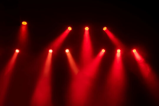 Red lights and smoke on stage in the concert