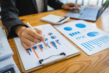 cropped shot view of a bookkeeper or financial inspector hands making a report, calculating or checking balance. Home finances, investment, economy concept