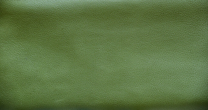Texture of green leather sofa pattern background