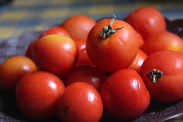 lots of red tomatoes on the plate
