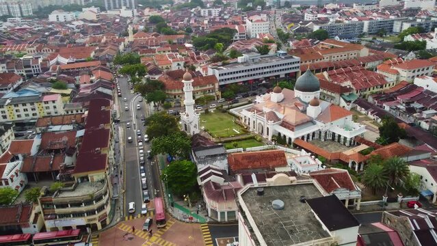 George Town, Malaysia: Aerial drone footage of the historic George Town city center with the Kapitan Keling Mosque in Penang island in chinatown and Little India