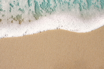 Fototapeta na wymiar sanfte Meer Welle am Strand , Sand, Hintergrund