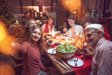 caucasian family taking selfie near Christmas tree together at home. Family,holidays,Christmas,thanksgiving concept