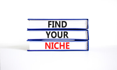 Find your niche symbol. Concept words Find your niche on books. Beautiful white table white background. Business and find your niche concept. Copy space.