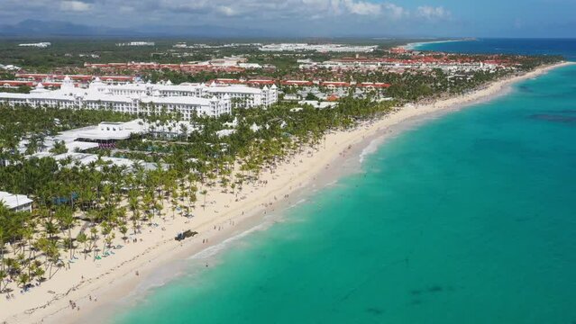 Arena Gorda beach with resorts. People faving fun on caribbean coastline. Aerial view from drone