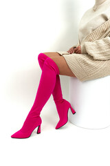 Woman's legs in shoes on isolated background