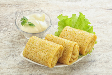 Stuffed pancakes with meat and cream