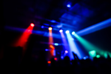 Stage, concert light. People are watching a concert