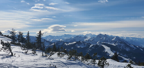 Panorama of the snow-capped Alps and view of the ski runs of Wagrain in Austria from the...