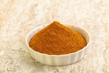 Dry Paprika powder in the bowl