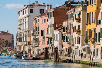 Fototapeta na wymiar Facades of centennial buildings on the banks of the Grand Canal in Venice. Italy, 2019