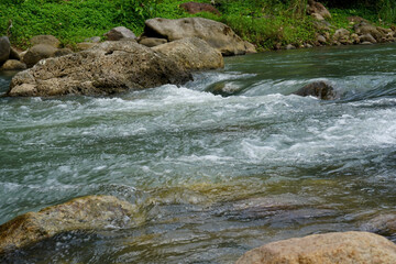 river with rocks in tropical indonesian nature    