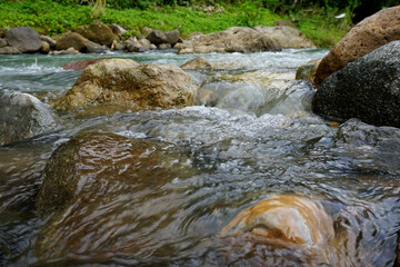 river with rocks in tropical indonesian nature    