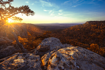 Scenic overlook vista from atop Petit Jean state park in Arkansas on the edge of the Ozark Mountains during golden sunset.  - obrazy, fototapety, plakaty