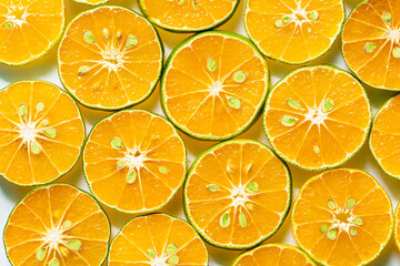 Obraz premium macro orange background,Heap of fresh orange slices background. Healthy nutrition with vitamin c. Close up view.