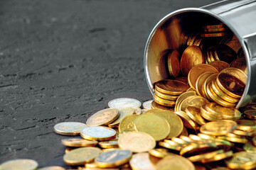 Gold coins on a black background. Pile of gold coins.Copy space. Treasure Hunt