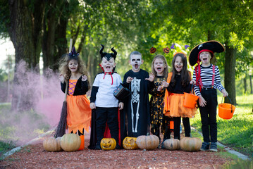 Fototapeta premium Today's day is full of fun. Happy group of kids on Halloween