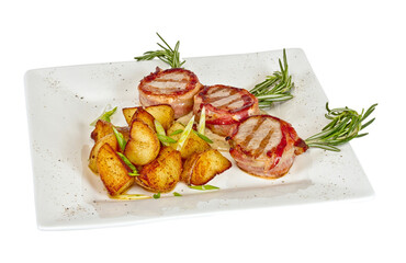 Grilled steak wrapped in bacon, with grilled vegetables