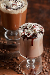 Coffee and chocolate drinks with whipped cream.