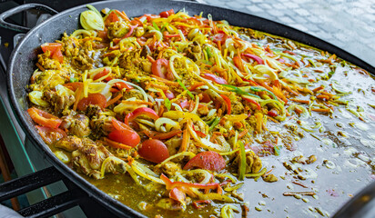 Spanish paella prepared in the street restaurant