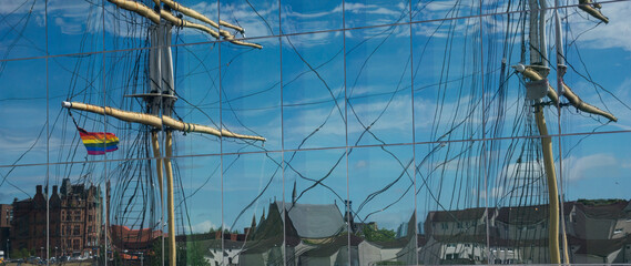 reflection of a sail in a glass window