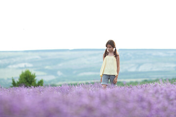 Happy girl in the lavender field. child running