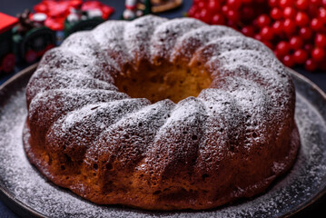 Homemade delicious round Christmas pie with red berries on a ceramic plate