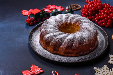 Homemade delicious round Christmas pie with red berries on a ceramic plate