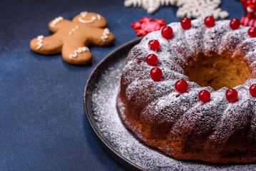 Homemade delicious round Christmas pie with red berries on a ceramic plate