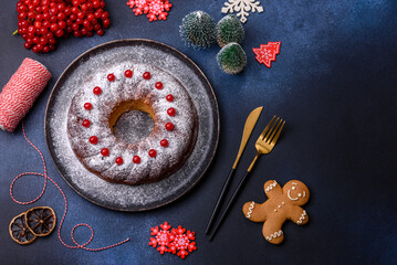 Homemade delicious round Christmas pie with red berries on a ceramic plate