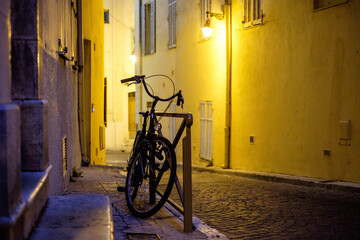 Fototapeta na wymiar Lone bike in Antibes, France at night