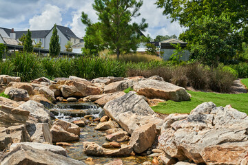 Fototapeta na wymiar Scenic view of waterfall in the Town of Trilith Studios Local Park; Trilith Studios Residential Homes Park 