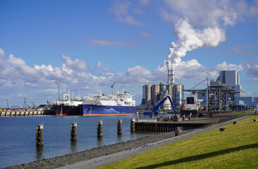 The brand new floating LNG terminal in the Eemshaven, beside a coal-fired power station (RWE).