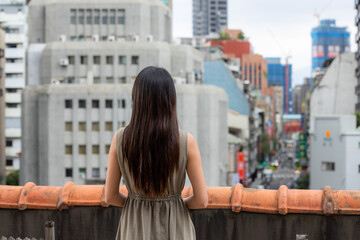 Fototapeta na wymiar Travel woman look at the city of Taipei